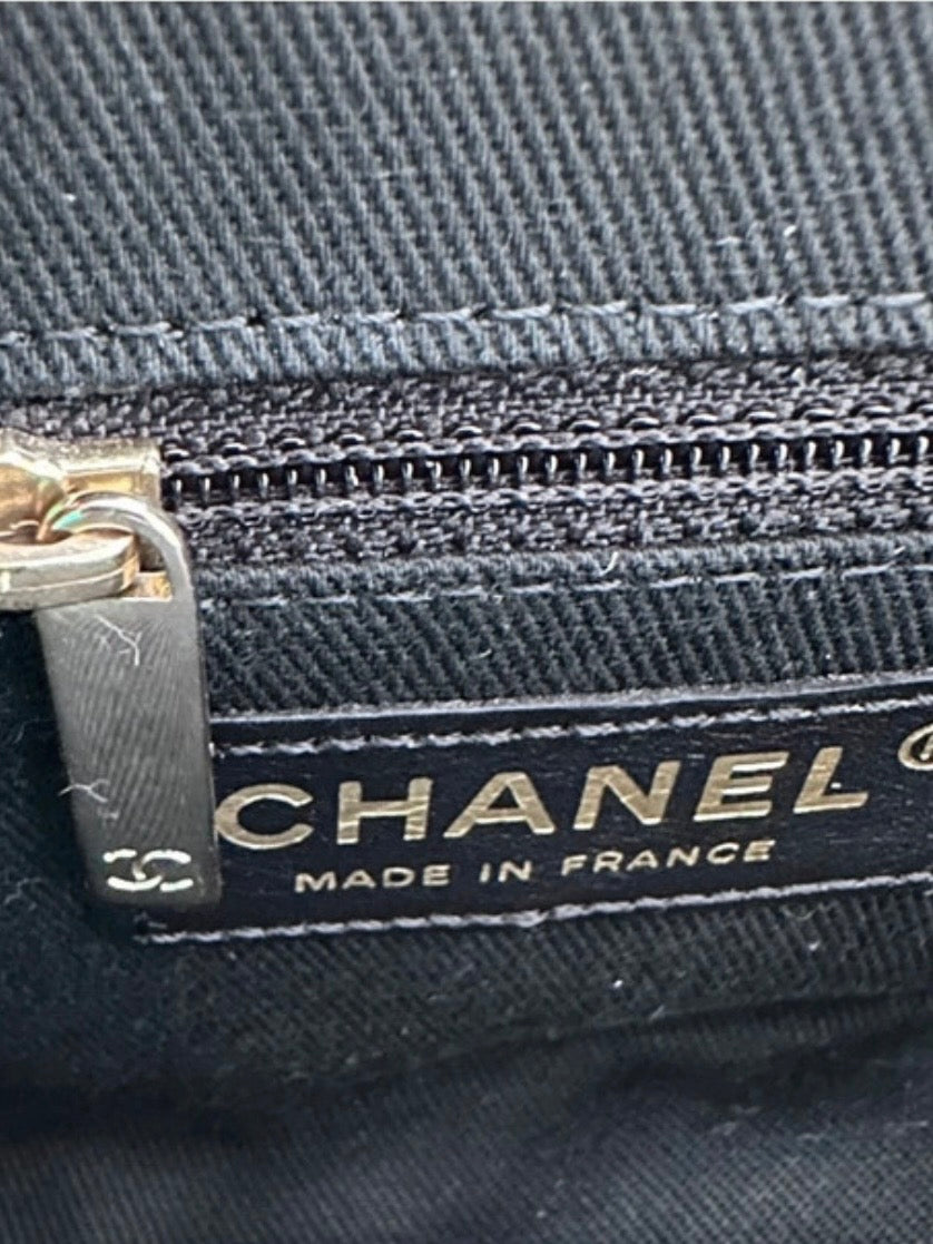 Chanel Logo Piercing Clutch Bag