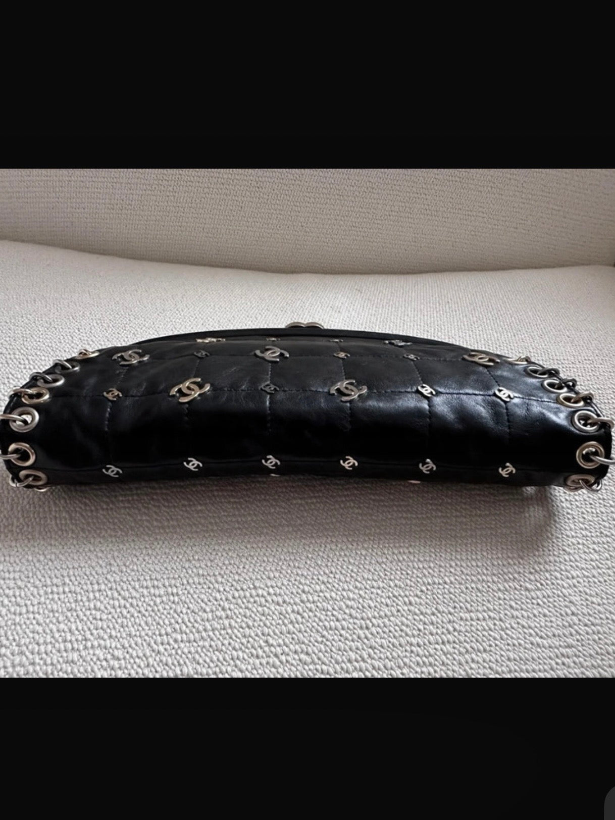 Chanel Logo Piercing Clutch Bag