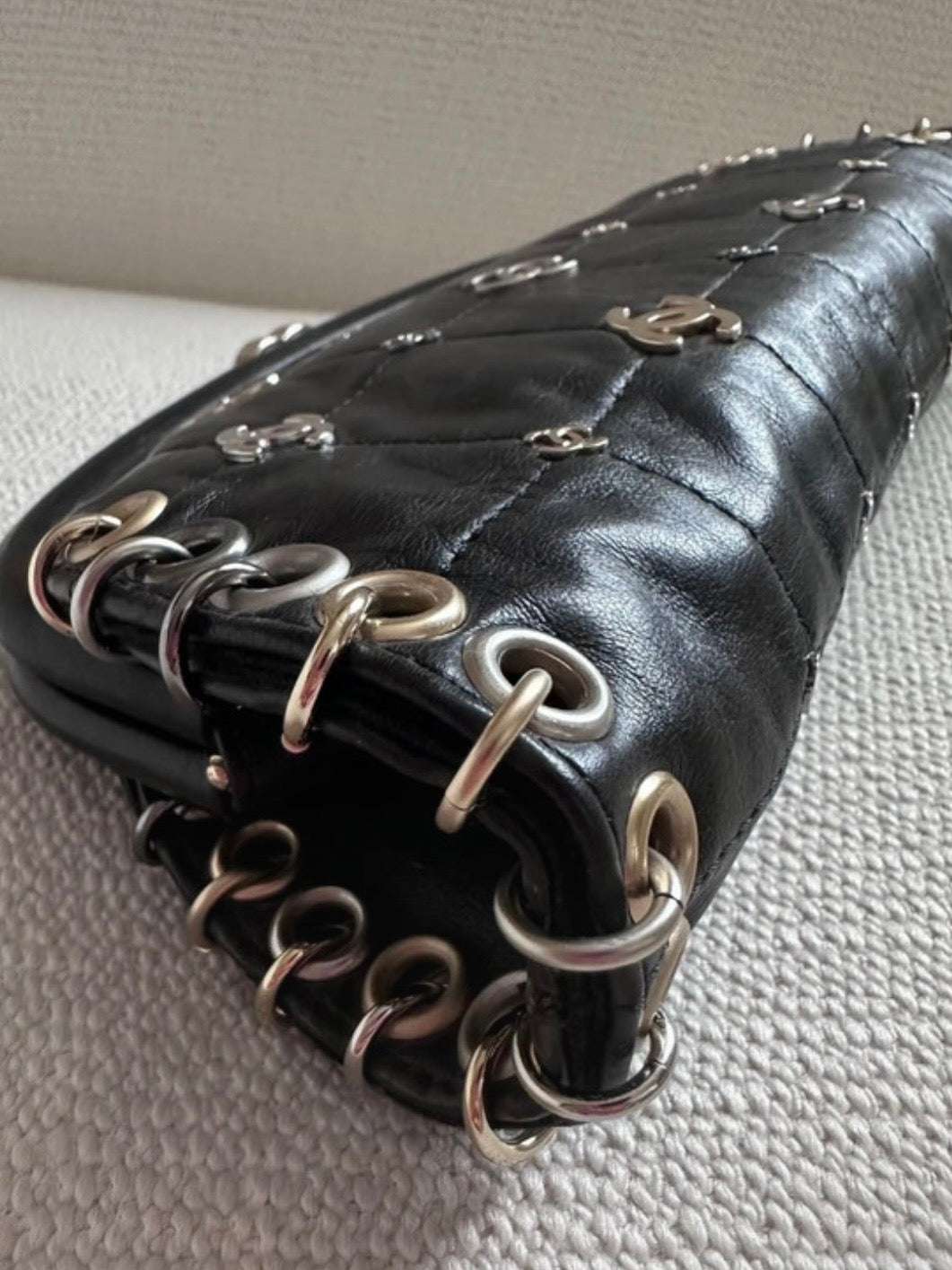 Chanel Logo Piercing Clutch Bag