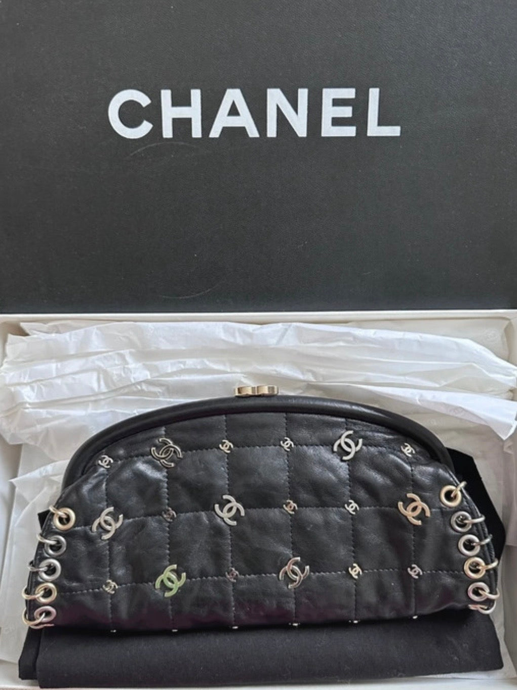 Chanel Logo Piercing Clutch Bag