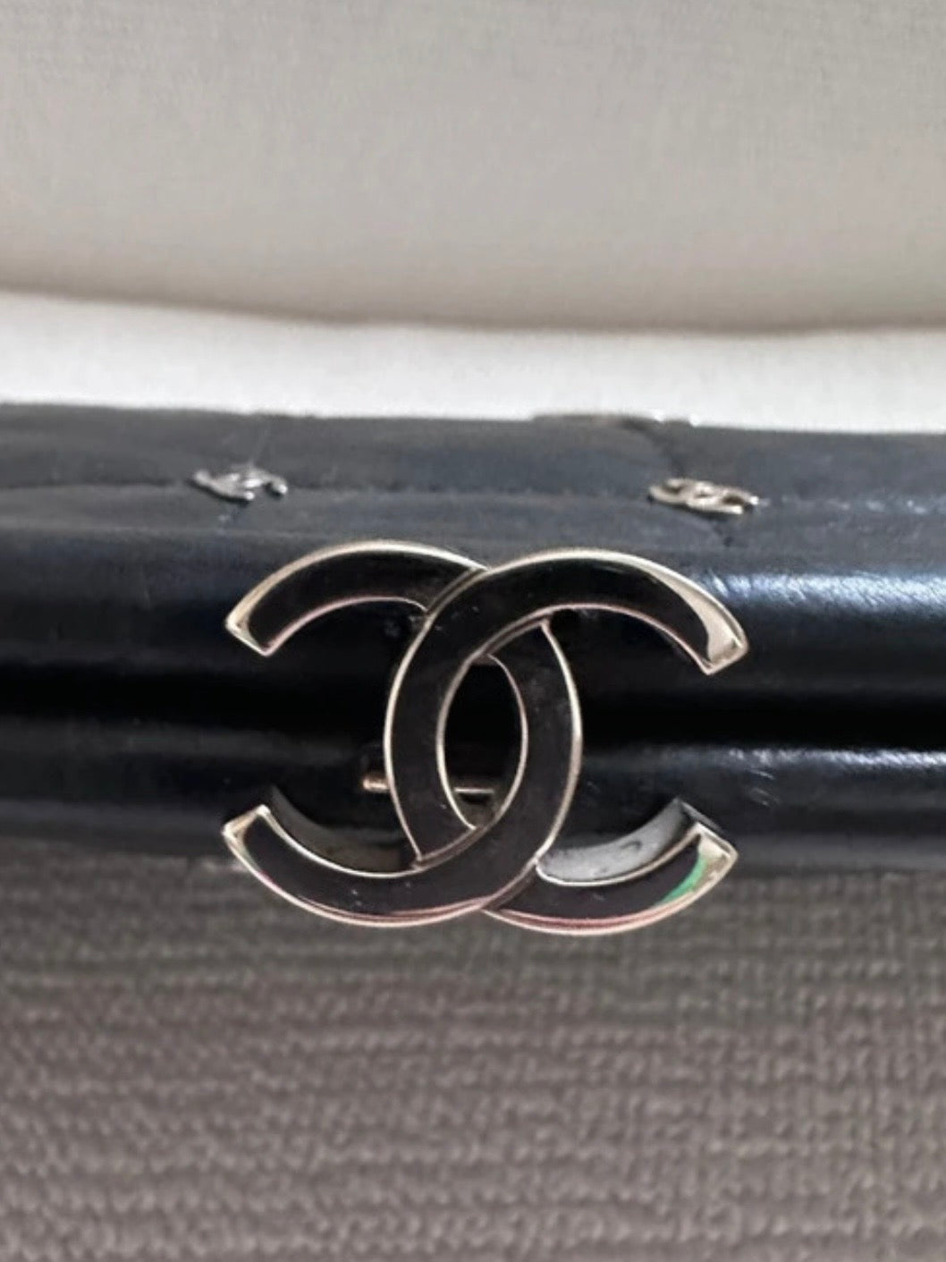 Chanel Logo Piercing Clutch Bag