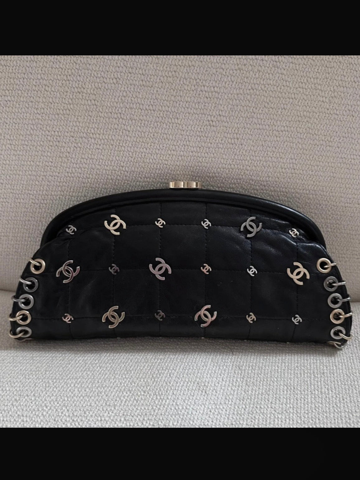 Chanel Logo Piercing Clutch Bag
